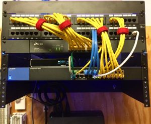 Network rack in use with lots of cables